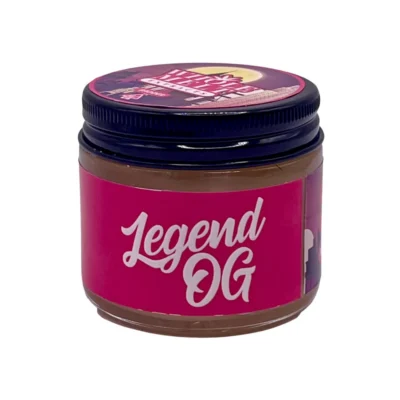 Creamy golden hue of authentic Whole Melt Legend OG Extracts badder concentrate inside a premium jar.