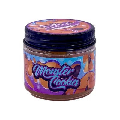 Creamy golden hue of authentic Whole Melt Monster Cookies Extracts badder concentrate inside a premium glass jar.